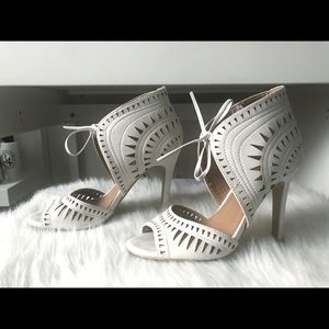 White laser cut tie up heels